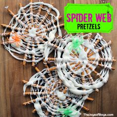 halloween pretzels with white icing and green sprinkles on them