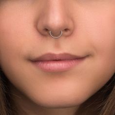 "Titanium septum clicker ring. This listing is for a single item. ITEM MEASUREMENTS: Available gauges (thickness of wire): 18g, 16g, 14g Available inner diameters: 8mm, 10mm, 12mm MATERIALS USED: We create this jewelry using highest quality implant grade 23 Titanium (ASTM F-136) - best choice for people with sensitive skin. However, pure titanium version can be made upon request. SHIPPING & HANDLING: We will pack your jewelry with great care. It will come in a small and very cute jewelry box Nickel-free Hoop Septum Ring For Everyday, Nickel Free Hoop Septum Ring For Everyday Wear, Hypoallergenic White Gold Hoop Septum Ring, Nickel-free Hoop Septum Ring, Nickel Free Minimalist Hoop Septum Ring, Minimalist Nickel-free Hoop Septum Ring, White Gold Hoop Nose Rings, Minimalist Hoop Nose Ring, Opal Septum