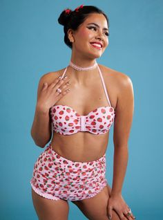 It doesn't get any better than chilling poolside with a berry sweet treat! Soak up the sun in this pink swim top  featuring an allover strawberry and heart print. Comes with halter tie straps and a back hook strap. Complete with removable pads. Pair it with the matching bottoms to complete your look!Bottoms not included.Swimwear can only be returned unworn with original tags intact and sanitary panel in place.82% nylon; 18% spandexHand wash cold; dry flatImportedListed in junior sizesModel Playful Swimwear With Adjustable Straps For Summer, Summer Strawberry Print Swimwear, Spring Strawberry Print Swimwear, Summer Strawberry Print Swimwear For Beach Season, Fitted Strawberry Print Swimwear For Poolside, Spring Strawberry Print Swimwear For Beach, Strawberry Print Swimwear For Spring Beach, Strawberry Print Swimwear For Summer Beach, Strawberry Print Swimwear For Beach In Summer