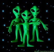 two green aliens standing next to each other