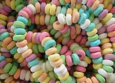 a pile of colorful candy sprinkles sitting on top of each other