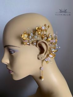 Handmade ear cuff gold color will definitely make your outfit so wild! Slip on an ear cuff for a look that will transform your ear immediately!  This is a perfect bridal Fantasy cuff earring created with  crystal beads and metal  butterflies, flowers, moonstone, quartz My jewelry design is inspired by nature and made with the highest attention to detail and quality Be beautiful and unique with Vetochka4U jewelry! Decor - all length 13 cm = 5 inch Length ear cuff 6 cm = 2,3 inch Chain 8 cm = 3,14 inch Standard size The base of the cuff is flexible and you can give any shape! It's very comfortable and easy to wear. Price is for a single piece.  Ready to ship in 1-3 business days.  Each item is in a free gift box. You don't have to worry about presentation of your gift For any questions pleas Unique Gold Ear Cuff For Pierced Ears, Unique Gold Body Jewelry For Wedding, Gold Ear Climbers For Party, Adjustable Single Cartilage Earring For Parties, Gold Ear Cuff For Pierced Ears For Party, Gold Pierced Ear Cuff For Party, Elegant Adjustable Ear Cuff For Wedding, Unique Single Cartilage Earring For Party, Elegant Adjustable Wedding Ear Cuff