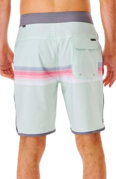 Sporty stripes and scalloped edges give these board shorts a sporty, surf-ready look. 48% polyester, 38% recycled polyester, 14% elastane Machine wash, line dry Imported White Moisture-wicking Surfing Shorts, White Moisture-wicking Shorts For Surfing, Moisture-wicking White Shorts For Surfing, Green Sporty Surfing Shorts, Sporty Green Surfing Shorts, Green Short Bottoms For Water Sports, Green Moisture-wicking Surfing Shorts, Scalloped Edges, Rip Curl