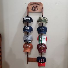 "Do you need to store or organize your caps (hunting, fishing, baseball) this double cap rack holds 20 baseball caps. It could be customized with your favorite logo and name. If you don't see the design or the logo you want please send me a message, I will be glad to work with you. Measuring 4ft high, and 1ft wide , it fits necely in your master bedroom, kids bedroom, closet, den, garage. Weight is just under 7 pounds, so it won't strain your wall. PERSONALIZE OPTION: Personalize any design with Baseball Hat Collection Display, Hat Hanger Ideas Baseball Caps, Baseball Hat Wall Display Men, Baseball Bat Hat Rack, Hat Wall Display Baseball Cap, Adult Apartment Decor, Organize Baseball Hats, Baseball Cap Rack, Cap Rack