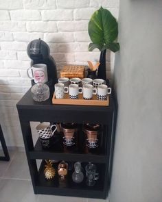 there is a shelf with coffee cups on it