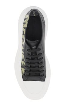 Leather Tread Slick sneakers by Alexander McQueen with rubber toe and base and contrasting Graffiti logo print on the side. It features side embossed logo, enameled metal eyelets, logoed ribbon on the back and printed logo on the tongue. Leather lining, rubber sole. Extra laces included. Alexander Mcqueen Tread Slick, Graffiti Logo, Leather Cap, Beach Tote Bags, Embossed Logo, Lanvin, High Quality Leather, Mens Shoes Sneakers, Valentino Garavani