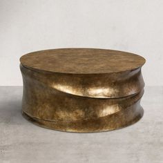 Sophisticated style with this rustic, modern farmhouse coffee table, used before a sofa or couch. Striking a round silhouette, the thick tabletop features antique brass - an elegant stage for displaying everything from remotes and coasters to trays of appetizers and drinks. Crafted of resin in an antique brass finish, the whole set in one piece offers added support and stability. This coffee table is an easy way to add a touch of vintage style to any apartment, dorm, or forever home. | NEWWORLDD Speakeasy Coffee Table, Round Drum Coffee Table, Round Gold Coffee Table, Modern Farmhouse Coffee Table, Farmhouse Coffee Table, Rustic Modern Farmhouse, Food Pantry Organizing, Apartment Dorm, Drum Coffee Table