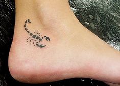 a small scorpion tattoo on the ankle