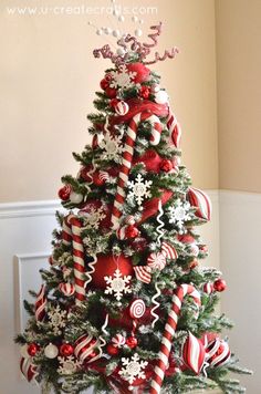 a christmas tree decorated with candy canes and ornaments