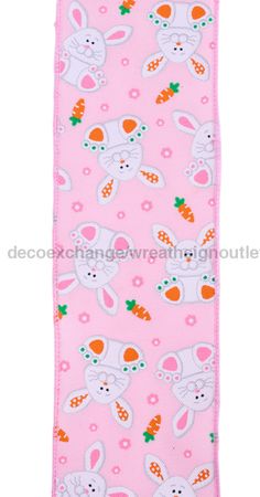 a pink blanket with rabbits and carrots on it