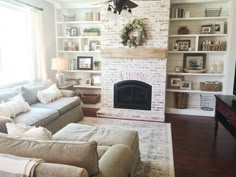 a living room filled with furniture and a fire place