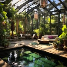 a room filled with lots of plants and furniture next to a swimming pool in the middle of a patio