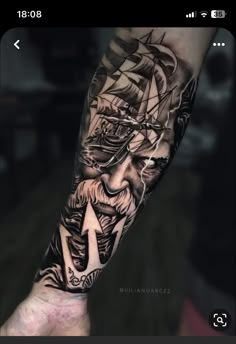 a man's arm with a ship on it