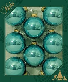 six blue glass ornaments in a box