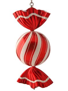 a red and white striped ornament hanging from a chain