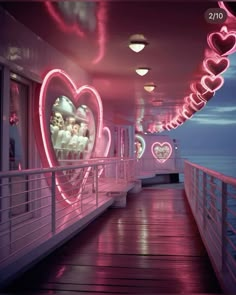 the inside of a cruise ship with lights and hearts on the wall, along with other decorations