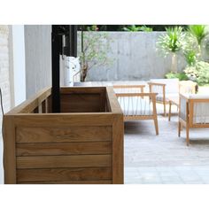 a wooden box sitting on top of a patio