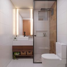 a bathroom with a toilet, sink and shower stall in the middle of the room