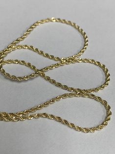 Hi Everyone on Etsy! This listing is for 1 strand of chain only. Items Detail 14K Gold Filled Clasp : Lobster Claw Chain Style : Rope Chain/ Singapore Style Length : 17.7 Inches Width : 1.6 mm in diameter This is a very simple charming chain, a fine chain and perfect for that minimalist look If you any questions regarding our products, bulk discount, and issue please send us a message Our Storefront Page is https://www.etsy.com/shop/WarungBeads Thank you for your visit! Gold Rope Chain Necklace, Gold Jewelry With Oval Link Rope Chain, Rope Chain Necklace With Curb Chain For Gift, Gift Rope Chain Necklace With Curb Link, Gold Oval Link Rope Chain Jewelry, Rope Chain Necklace Gift, 14k Gold Curb Chain Rope Necklace Gift, Silver 14k Gold Rope Chain Necklace, Minimalist Gold-plated Rope Chain Necklace