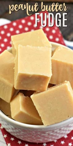 homemade peanut butter fudge in a white bowl on a red and white tablecloth