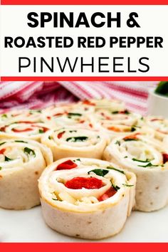 spinach and roasted red pepper pinwheels on a plate with text overlay