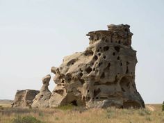 an old rock formation in the middle of nowhere