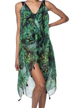 Dive into the summer season with the Moonlight Green Leaf Print Sundress. Perfect for those who love a seamless transition from the tranquility of the poolside to the lively ambiance of a party, this sundress is the epitome of effortless chic. Crafted in a sheer, lightweight fabric, it boasts a beautiful blue hue reminiscent of the ocean, ensuring you carry the essence of the sea wherever you go. Pool to Party One-Size fits most 100% Sheer Soft Hand Poly Made in the USA of Imported Fabrics One-piece Beach Dress For Summer Parties, One-piece Beachwear Dress For Summer Parties, Halter Neck Tropical Print Swimwear For Summer, Green Cover-up For Poolside Vacation, Green Vacation Cover-up For Poolside, Spring Pool One-piece Cover-up, Beachy Dresses For Summer Parties, Green Cover-up For Beach Party Vacation, Green Summer Pool Cover-up