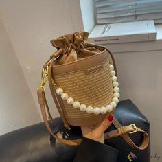 Bird in Bag - New retro straw drawstring bucket bag pearl single shoulder crossbody bag fashion women's bags Bucket Bag With Pearl Handle, Beige Bucket Shoulder Bag With Pearl Handle, Crossbody Bag Fashion, نظارات شمسية, Drawstring Bucket Bag, Bag Fashion, Women's Bags, Bago, Saddle Bags