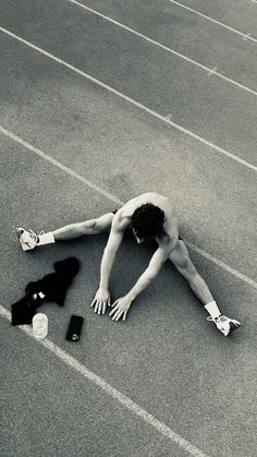 a man laying on the ground with his head down