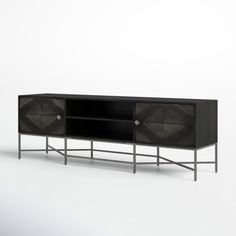 the sideboard is made from black wood and has an iron frame with geometric designs