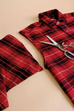 a pair of scissors and some red flannel