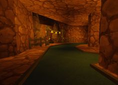 an animated image of a golf course in a cave with rocks on the walls and green grass