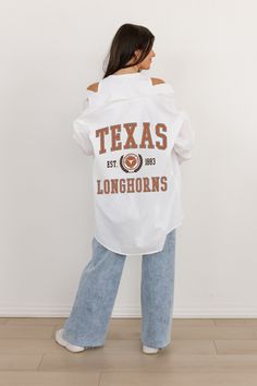 Elevate your game-day look with our Texas Longhorns White Button-Down Collared Top featuring a vintage team logo. This classic, crisp shirt offers a polished yet sporty style, perfect for showing your team pride in a timeless, sophisticated way. Ideal for any occasion, from casual outings to game-day celebrations. Madi Prewett, Collared Top, Texas Longhorns, White Button Down, Sporty Style, Team Logo, Victorious, Button Downs, Texas