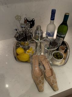 there are many bottles and glasses on the counter