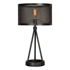 a black table lamp with a light on it