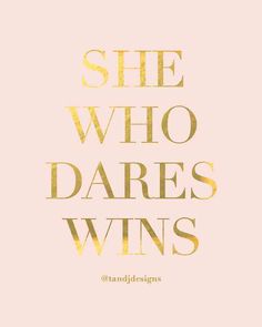 the words she who dares wins are shown in gold foil on a pink background