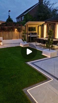 a backyard with grass and lights in the evening time, as well as an outdoor dining area