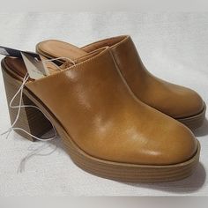 New Universal Thread Women's Tan Clogs, Size 8 . New With Tags, All Man Made Material Uppers. No Damage, Comes From A Pet And Smoke-Free Environment. Casual Slip-on Mules With Padded Heel, Casual Synthetic Mules With Round Toe, Casual Synthetic Clogs For Fall, Casual Closed Toe Heels With Reinforced Heel, Trendy Slip-on Clogs With Round Toe, Trendy Mules With Padded Heel And Round Toe, Casual Synthetic Mules With Wedge Heel, Casual Synthetic Mules With Open Heel, Casual Slip-on Heels With Reinforced Heel