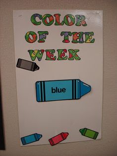 a bulletin board with the words color of the week written on it and crayons