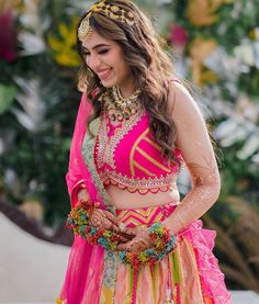 a woman in a pink and yellow outfit