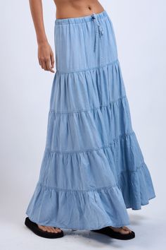 The Denim Days Maxi Skirt features a lightweight denim fabric and tiered ruffle design. Perfect for year-round wear and has an drawstring waistband for all-day comfort Material & Care: Made from 100% Tencel. For best care, machine wash cold with like colors on a gentle cycle. Use a mild detergent. Avoid bleach. Hang to dry. Iron on low heat if needed Size & Fit: Model is 5'8" wearing size small Bust: 34B Waist: 24 Hips: 34 Ruffle Design, Tiered Maxi Skirt, Denim Day, Denim Maxi, Denim Maxi Skirt, Top Graphic Tees, The Blues, Modern Chic, Drawstring Waistband