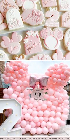 pink and white mickey mouse cookies are arranged in the shape of heart - shaped balloons