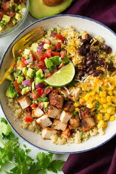 a plate filled with rice, meat and vegetables