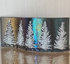 a metal box with some trees on it