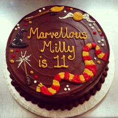 a birthday cake with the words marvelous milly is 11 on it's side