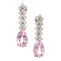 Light pink pear shaped morganite and diamond dangle drop earrings. Fllexible rows of bright white full cut diamonds. Circa 1960 2 pear shape pink morganite, approx. total weight 6.59cts, VS 30 round brilliant cut diamonds, approx. total weight .90ct, G-H, VS-SI 18k white gold Stamped: 18k 5.6 grams Top to Bottom: 30.1mm or 1 3/16 Inch Width: 8.2mm of 1/3 Inch Depth or Thickness: 6.4mm Luxury Pink Diamond Earrings Brilliant Cut, Luxury Pink Brilliant Cut Diamond Earrings, Formal Pink Diamond Earrings, Pink Diamond Earrings For Formal Events, Fine Jewelry, Fine Jewelry Pink Diamond Earrings For Formal Occasions, Pink Diamond Earrings For Formal Occasions, Elegant Pink Diamond Earrings With Accents, Classic Pink Diamond Earrings For Formal Occasions, Pear-shaped Pink Diamond Jewelry