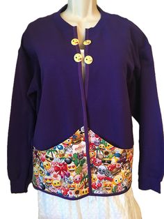 a woman's purple jacket with cartoon characters on the front and back, sitting on a mannequin