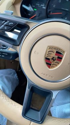 the interior of a car with steering wheel controls