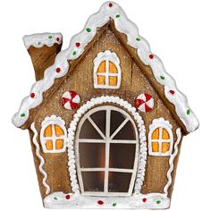 a gingerbread house ornament on a white background