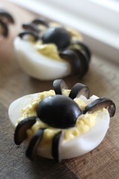 deviled eggs with black and white decorations on them